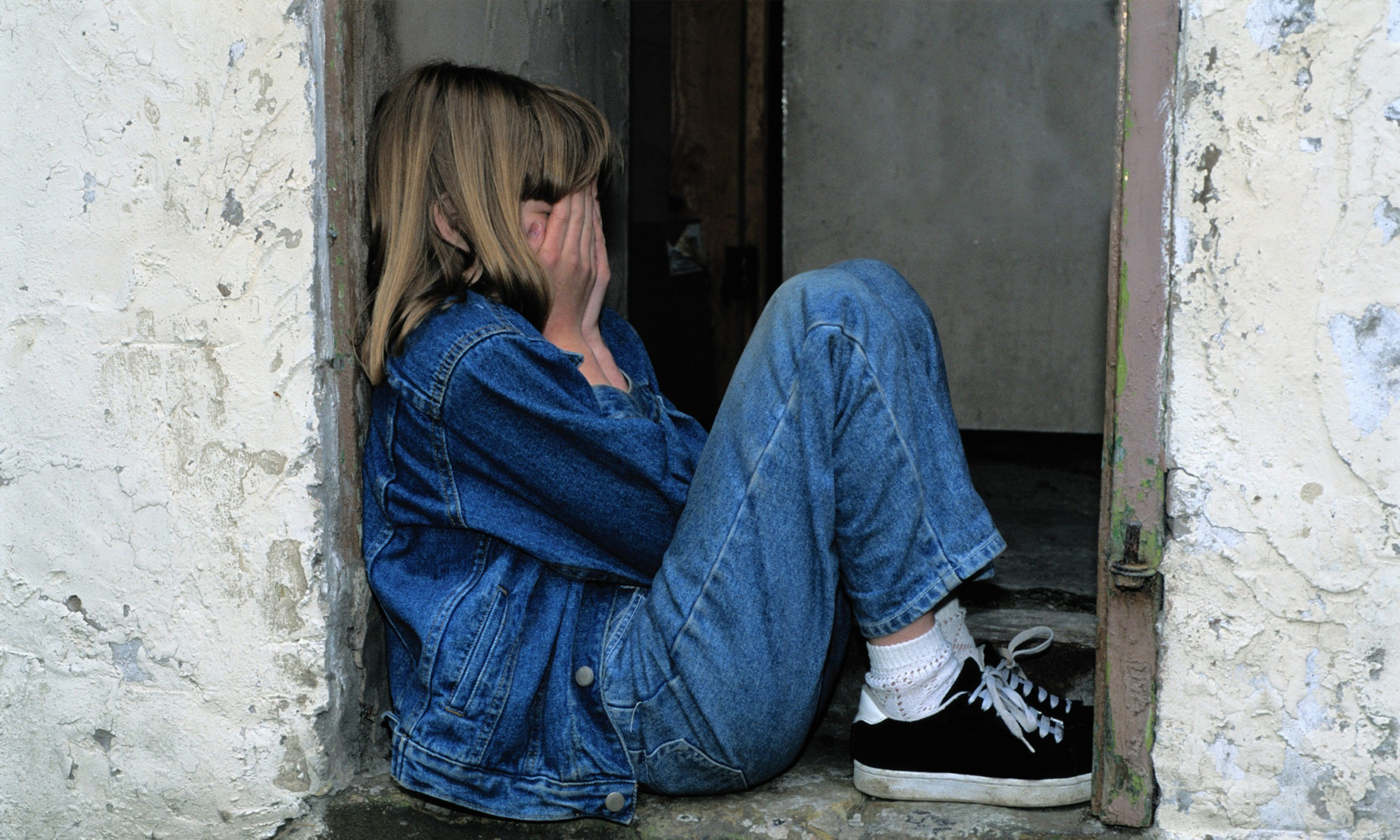 girl hands covering face