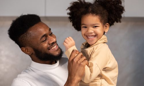 black father and daughter posing for how to start a child modeling career