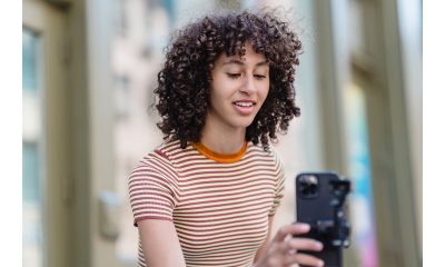 curly teen holding camera for how to start practicing acting at home